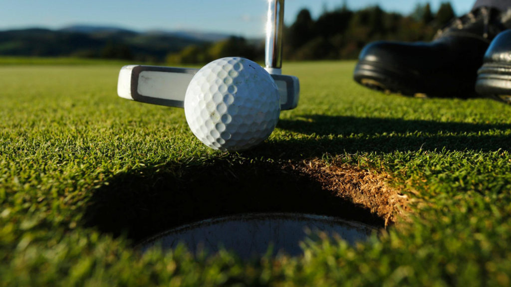 Golf ball and hole